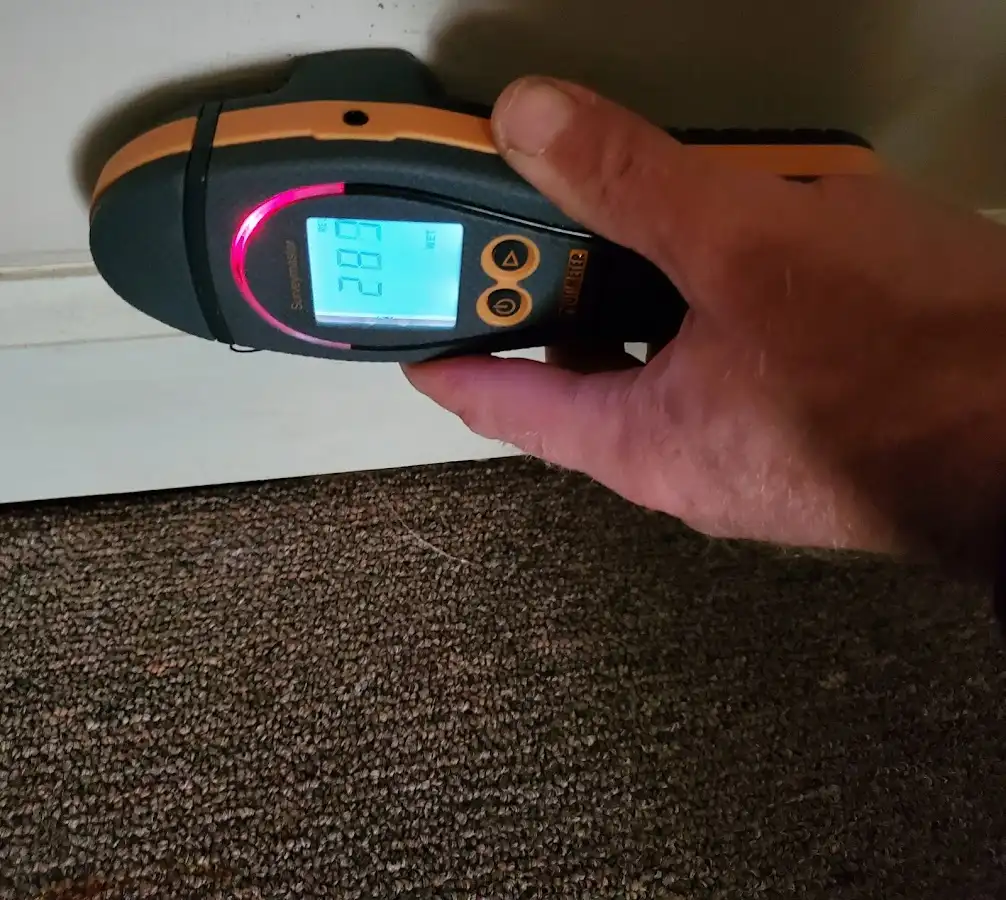 Moisture detection at baseboard during Storm Damage Restoration in Big Bear Lake